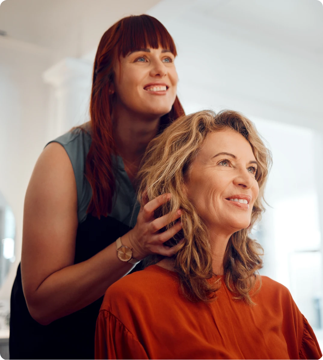 Hairdresser styling client's hair